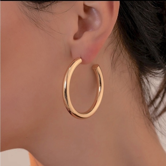 Simple gold loop earrings. Mid sized. A little larger than a quarter - Picture 1 of 6